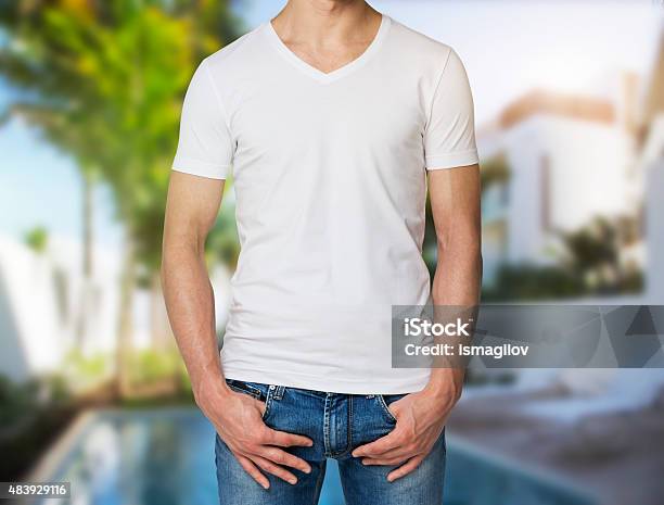 Man In A White V Shape Tshirt Hands In Pockets Stock Photo - Download Image  Now - 2015, Adult, Blank - iStock
