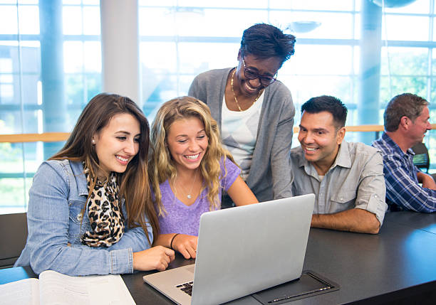 istock Group of university students with teacher in classroom 483929542