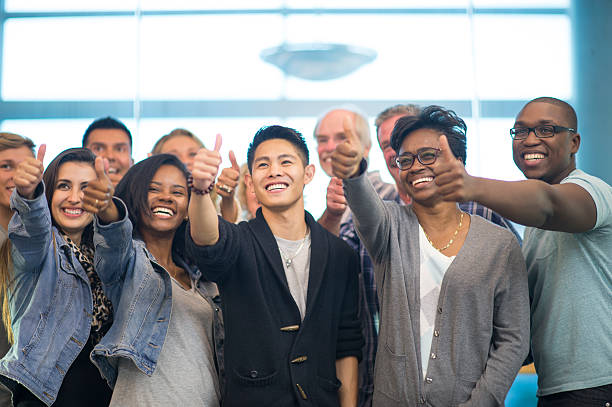 istock Multi-ethnic group of all age university students doing thumbs up 483929580