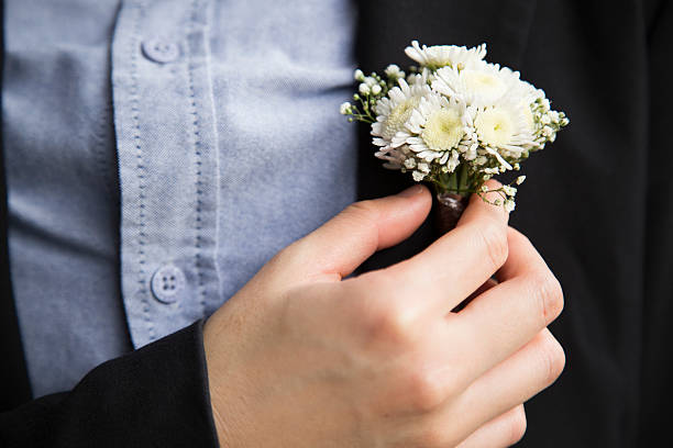 istock White Flower on Chest Groom 483930372