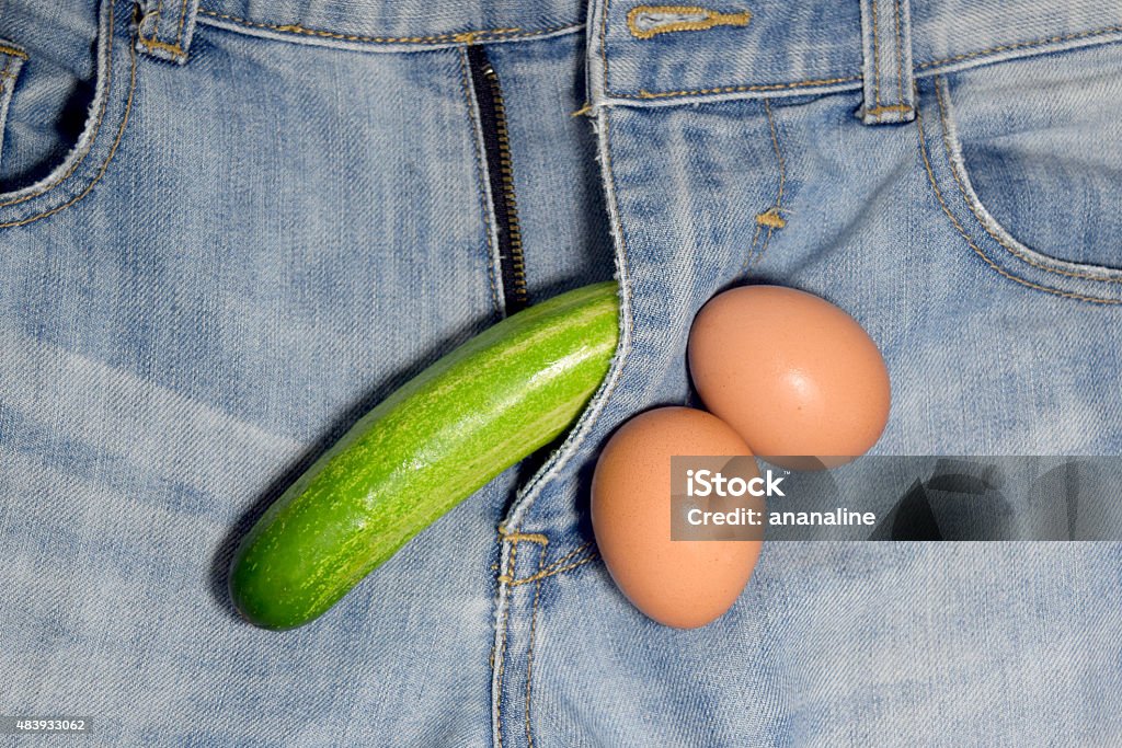 PENIS - cucumber and eggs on Jeans background 2015 Stock Photo
