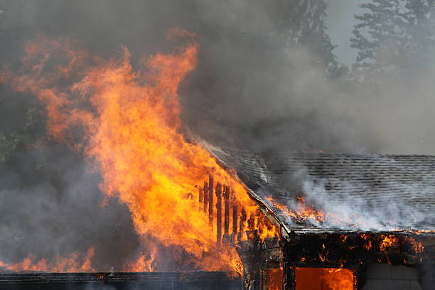 istock Burst Of Fire Coming From A Burning House 483933370