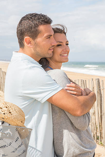 istock Loving couple looking ocean 483935910
