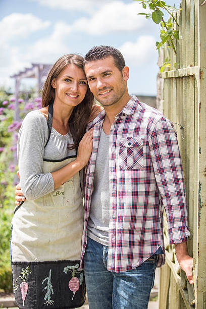 istock Young couple gardening 483936388