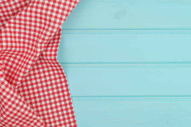 istock White and red towel over wooden table 483946028
