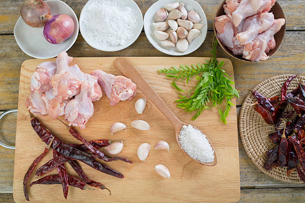 istock Chicken wing stick on the wood chopping block 483946300