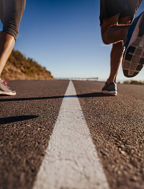 istock Runners on middle of the road 483947284