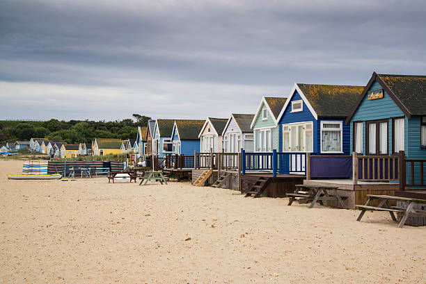 istock Lovely beach huts on sand dunes and beach landscape 483949580