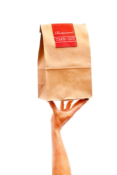 istock Hand Delivering Takeout Delivery Fast Food Bag Package Container 483951798