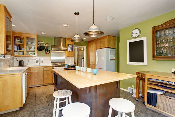 istock Unique kitchen with green walls, and island. 483953114