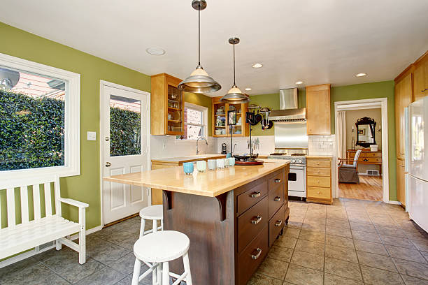istock Unique kitchen with green walls, and island. 483953130