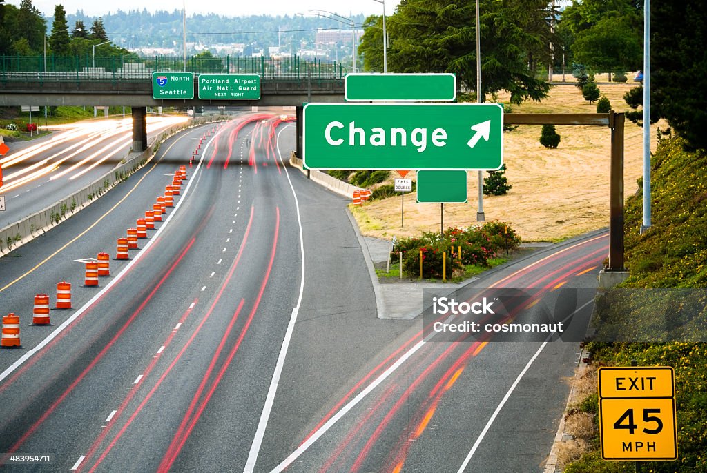 Change: This Way View of a freeway from an overpass at dusk; the word "Change" added in place of an exit name. Overpass - Road Stock Photo