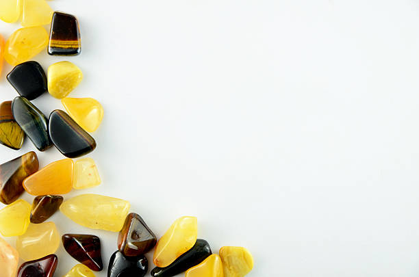 Yellow and black stones isolated on white background