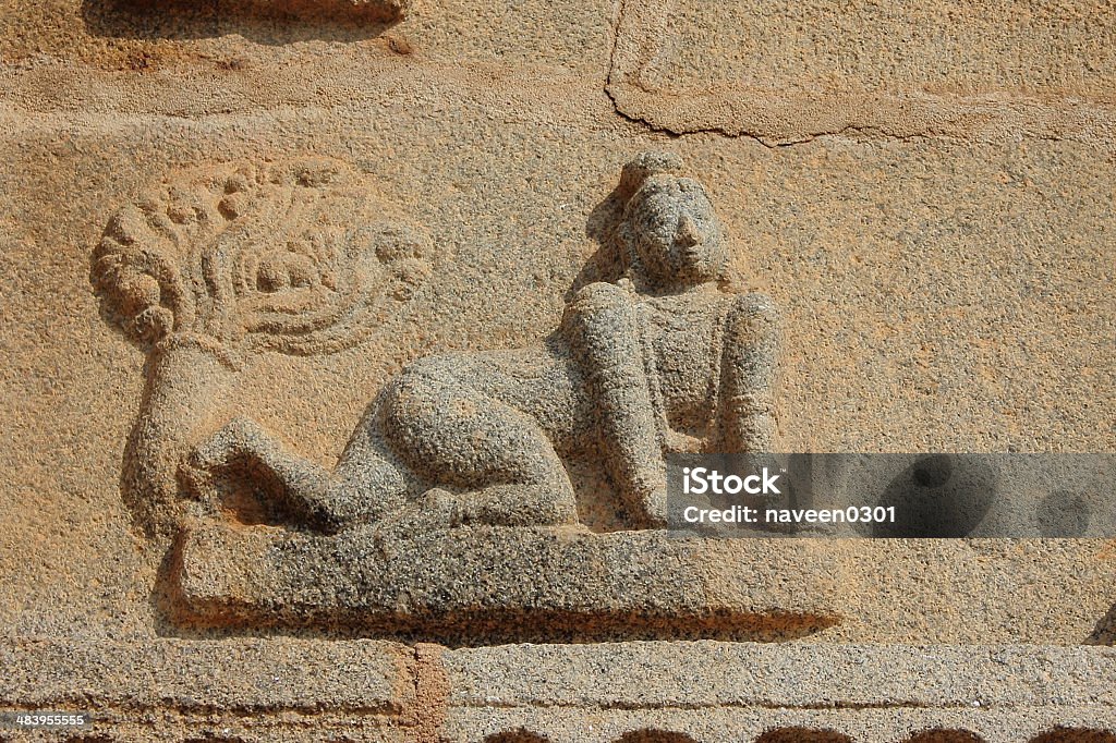 Childhood Krishna sculpture in Krishna temple Stone carved ancient Krishna sculpture of his childhood in Krishna temple, Hampi, Karnataka, India. Ancient Stock Photo