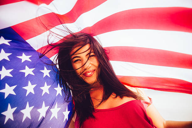 istock Girl with stars and stripes flag 483956089