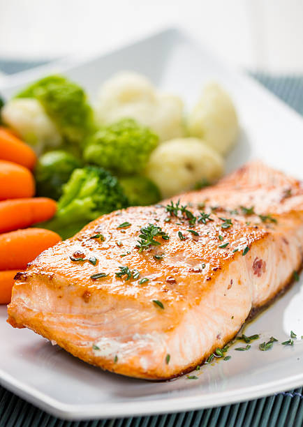 istock Fillet of salmon with mixed vegetables 483957983