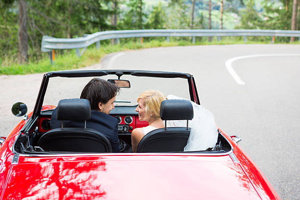 istock Happy wedding couple with cabriolet 483958191