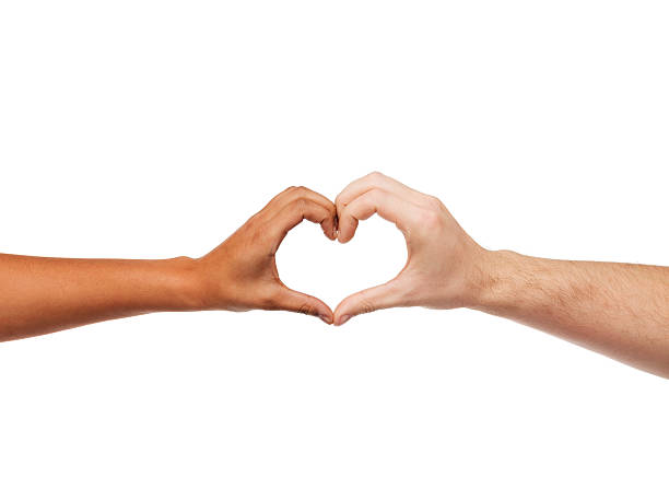 woman and man hands showing heart shape love and relationships concept - closeup of woman and man hands showing heart shape heart hands multicultural women stock pictures, royalty-free photos & images