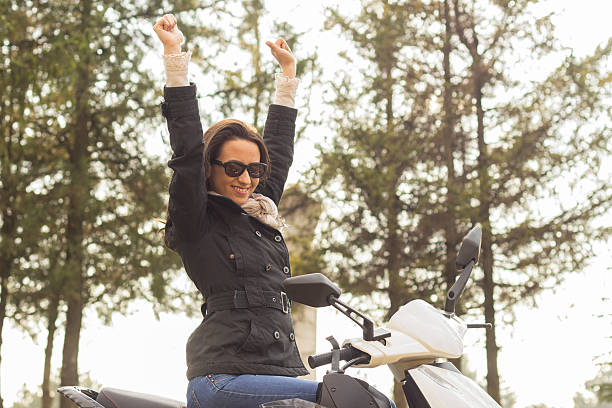 istock Young female enjoys a motorcycle ride 483960841