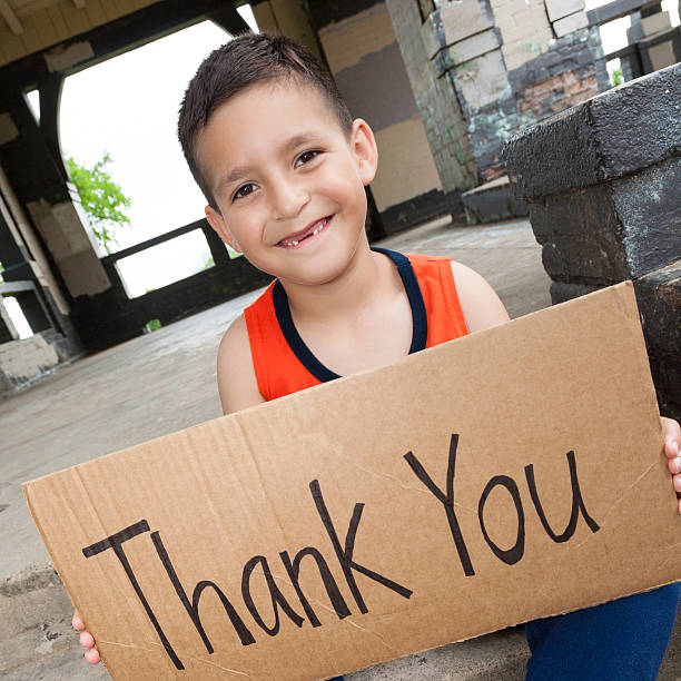 istock Cute young boy holding sign saying 'Thank You' 483960855