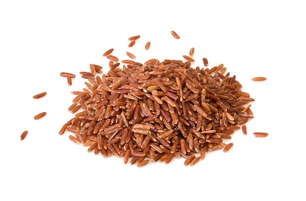 dziki ryż brązowy - brown rice rice heap brown zdjęcia i obrazy z banku zdjęć