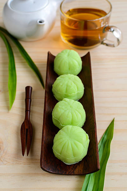 istock Greentea mochi flavored with bean filling and cup of tea 483964670