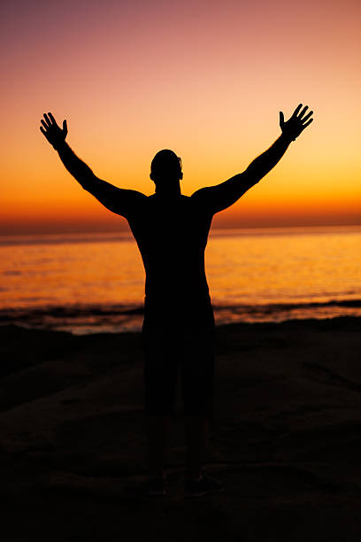istock Silhouette of a Happy Man at Sunrise 483964686