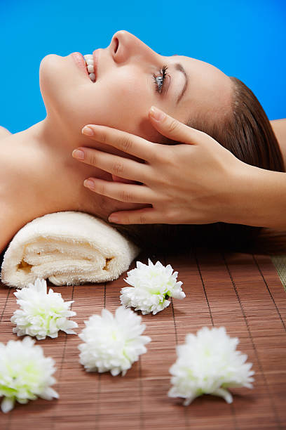 istock Young beautiful woman in spa environment 483964786