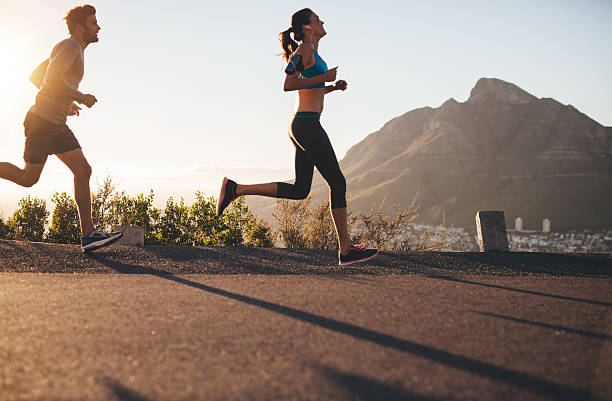 istock Young couple running in nature 483965508