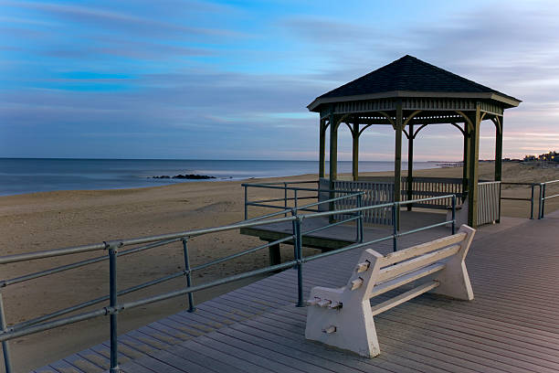 istock Quiet twilight view of a ocean shore and gazebo 483971898