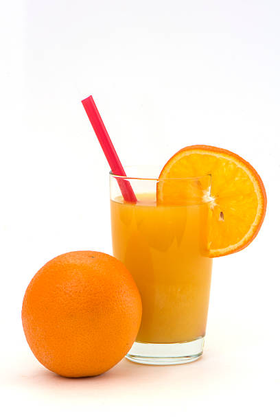 istock orange and segment with juice and a tube 483974272