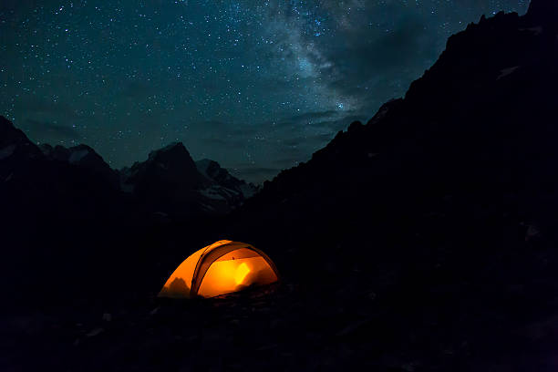 istock Night mountain landscape with illuminated tent 483974464