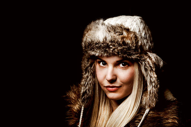 istock Young woman with fur hat, portrait 483974950