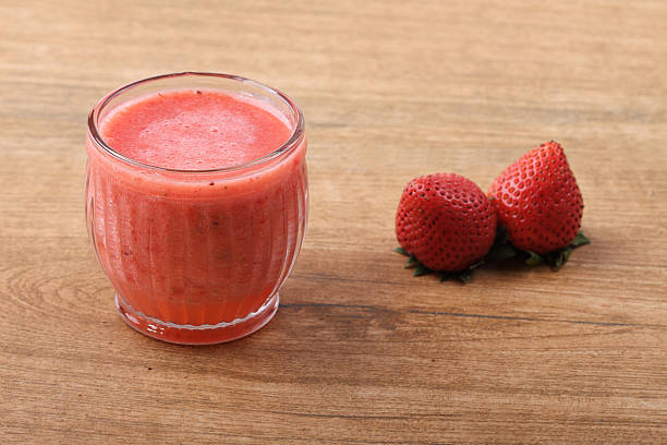 istock glass of strawberry fresh juice 483978268