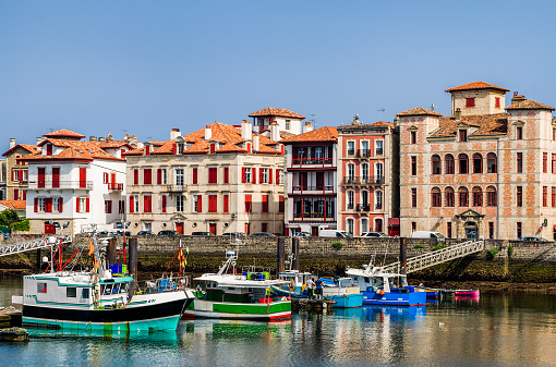 The harbour and quayside in Saint-Jean-de-Luz, Pays Basque, South West France with fishing boats.