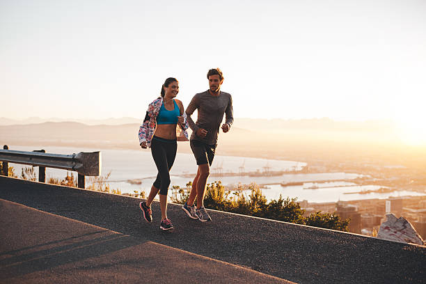 istock Young couple jogging early in morning 483979766