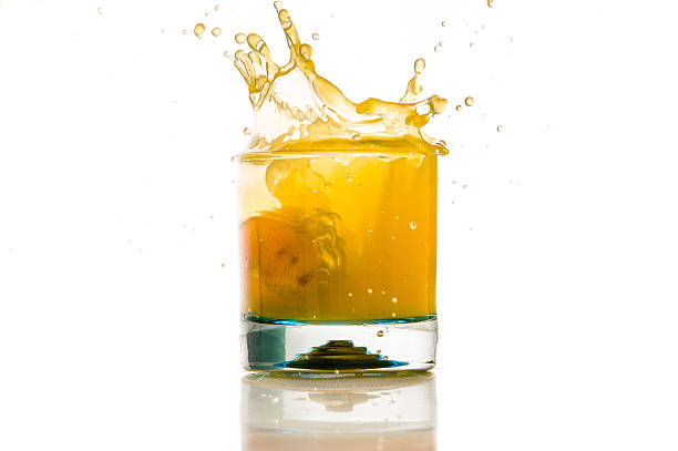 istock pouring orange juice splash on a white background 483989409