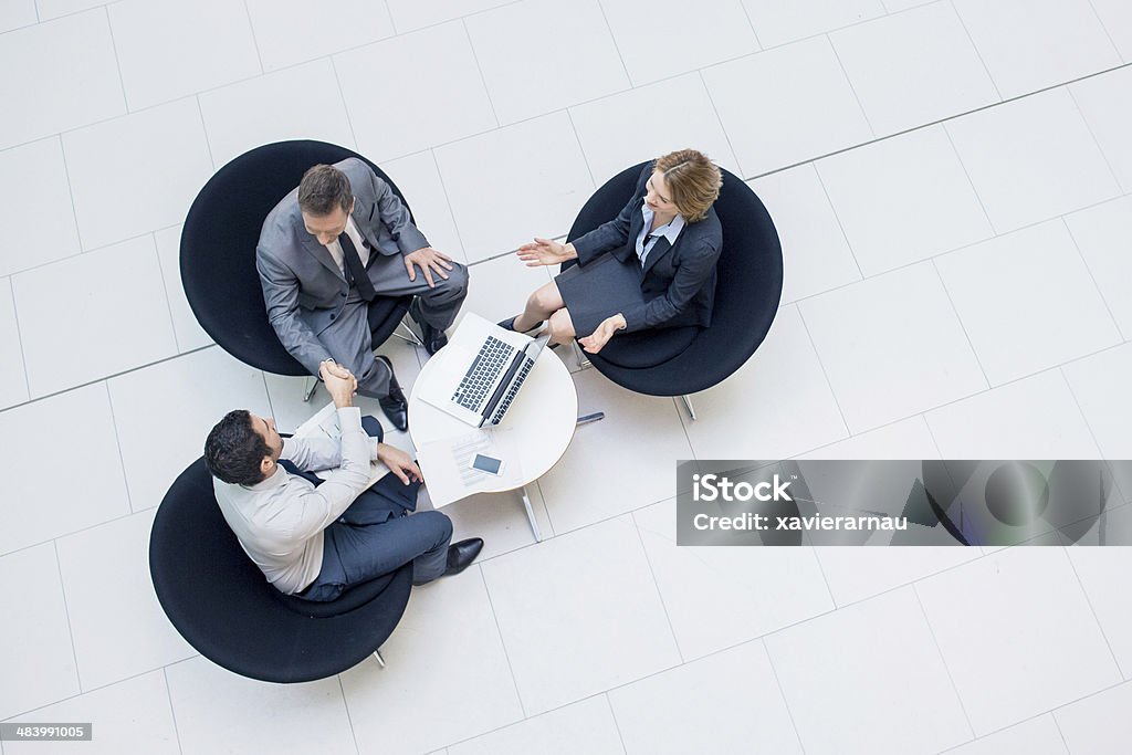 Deal done Three business people sealing a business deal. Business Stock Photo