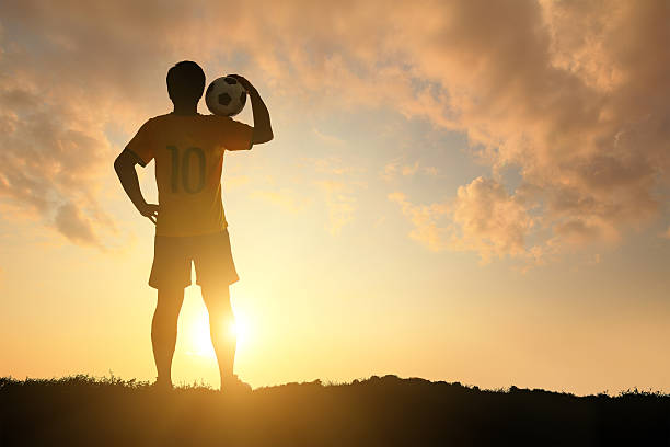 istock Man and soccer silhouette 483991019