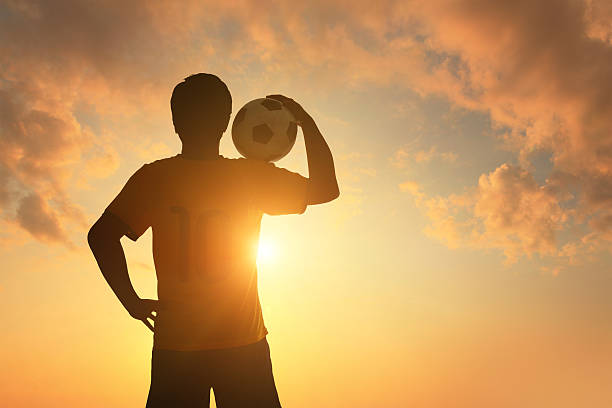 istock Man and soccer silhouette 483991043