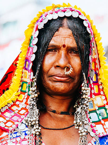 Karnataka woman Portrait of a  tribal woman with her traditional attire looking straight at the camera. She is from India South Western Karnataka state. india indigenous culture indian culture women stock pictures, royalty-free photos & images