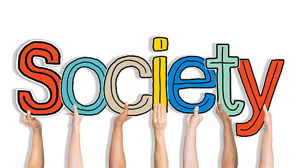 istock Multiethnic Group of Hands Holding Word Society 483993870