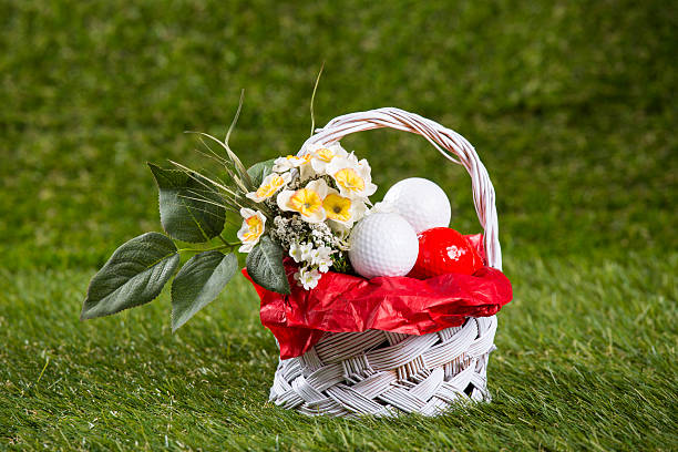 Easter Basket with Golf Balls and Flowers stock photo