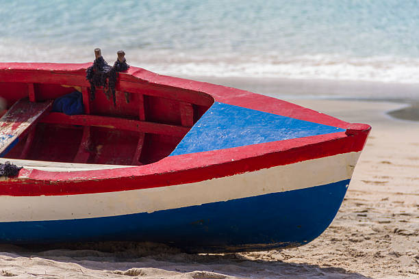Colorful Wooden boat on beach in Bequia, St. Vincent and the Grenadines.