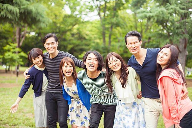 Happy group of people lying on the floor outdoors