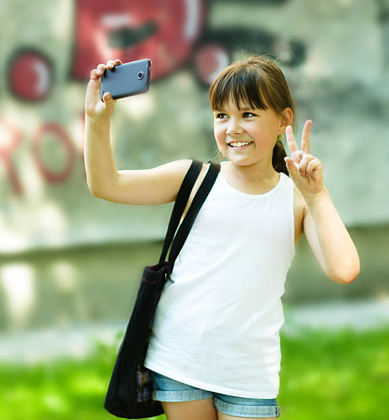 istock Girl makes self-portrait on the smartphone 483994568