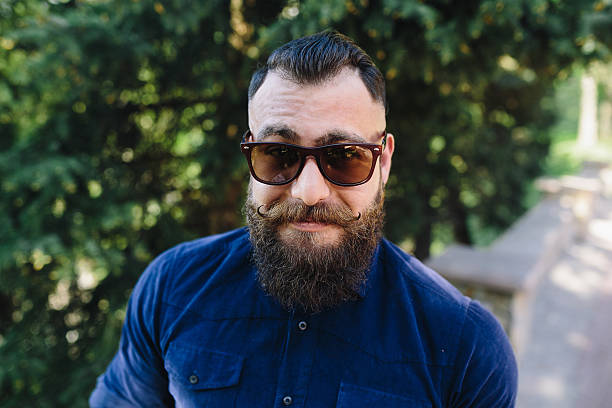 istock bearded speaks by phone 483996962