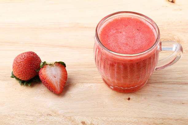 istock glass of strawberry fresh juice 483997910