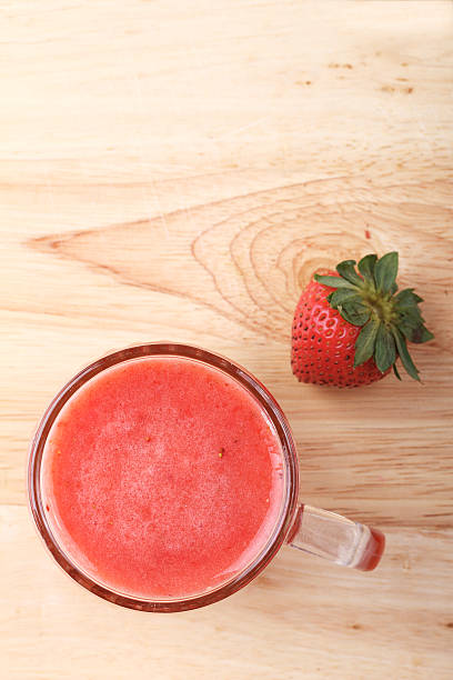 istock glass of strawberry fresh juice 483997922