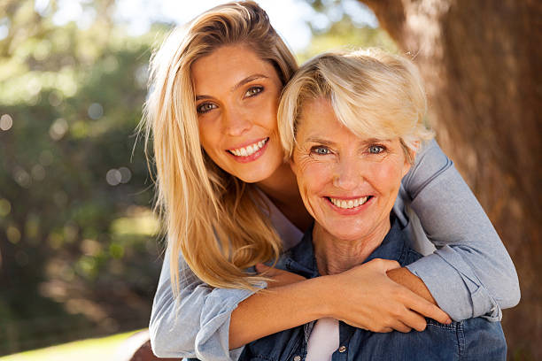 istock daughter hugging middle aged mother 483998142